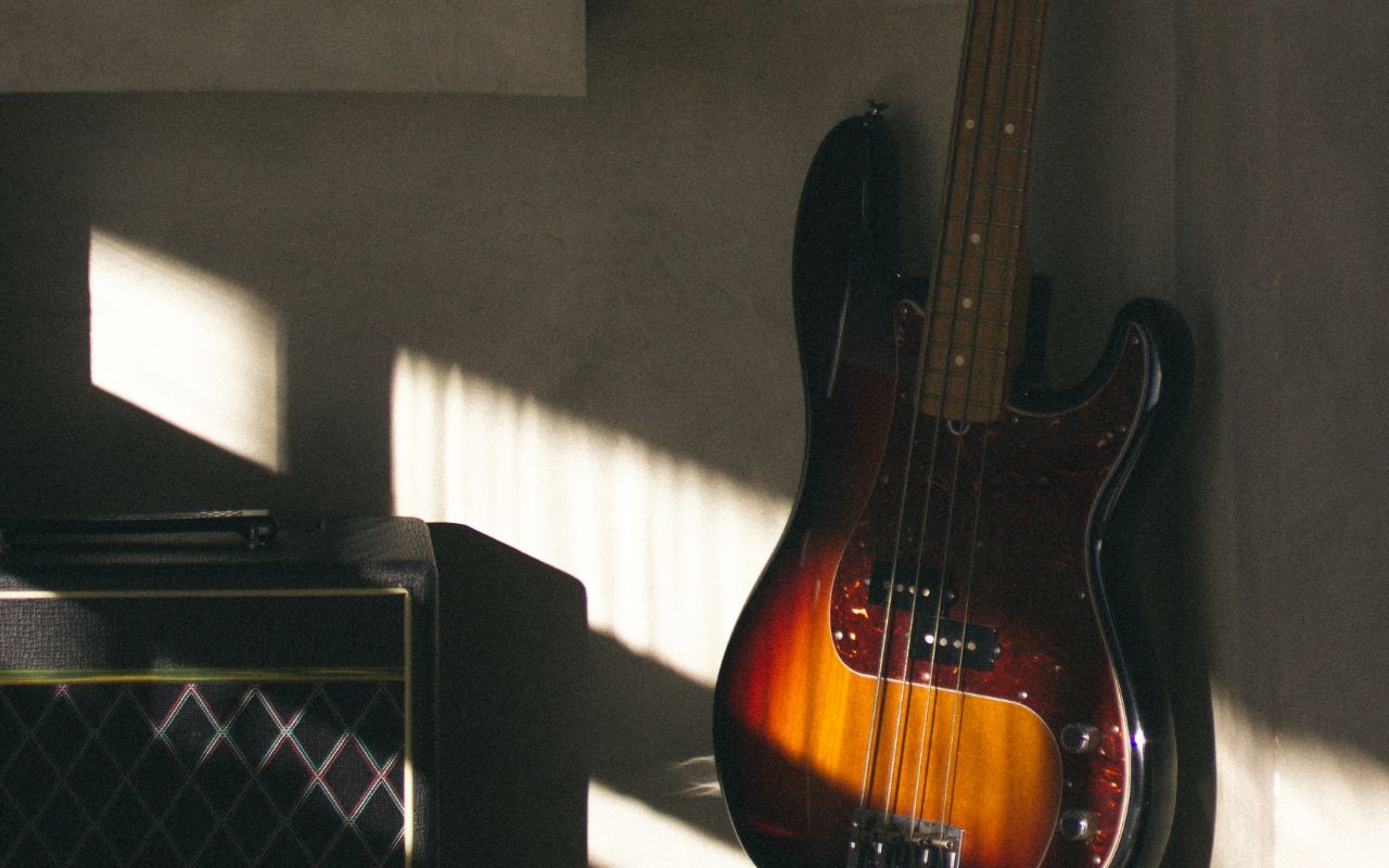 A bass in a corner of a room