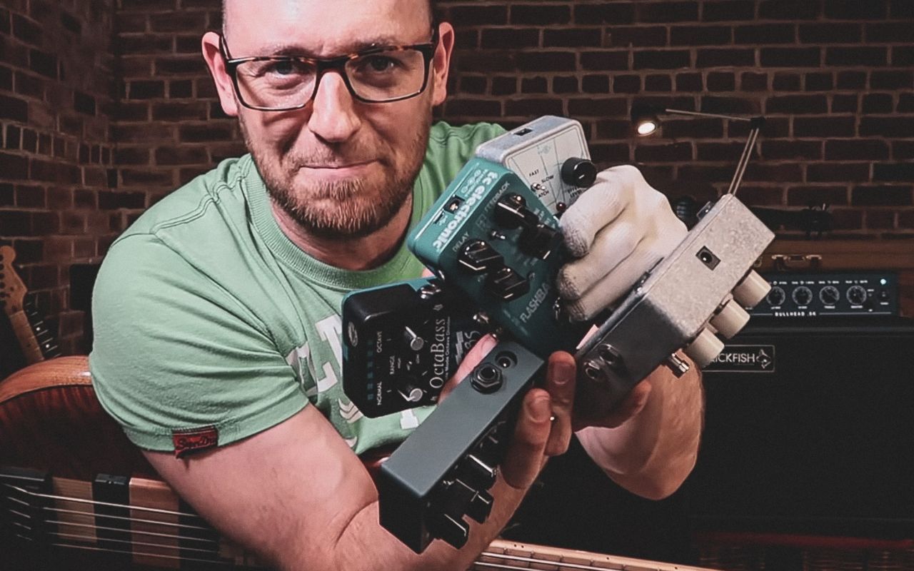 Scott holding a bunch of gear